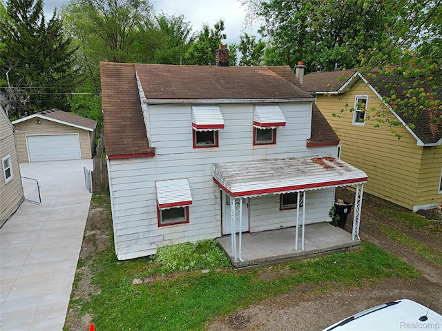 19444 Inkster Rd, Redford, MI 48240 - view of front of house with a detached garage, a chimney, an outdoor structure, and covered porch