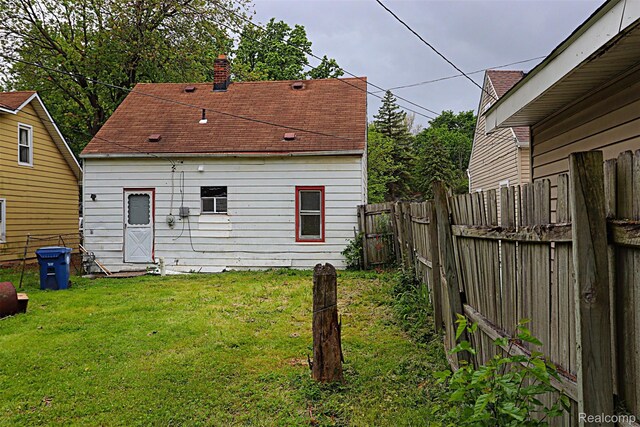 19444 Inkster Rd, Redford, MI 48240 - back of house with a chimney and roof with shingles