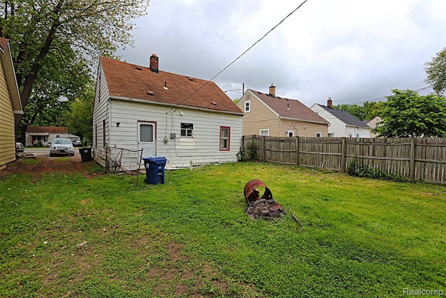 19444 Inkster Rd, Redford, MI 48240 - rear view of house with a chimney