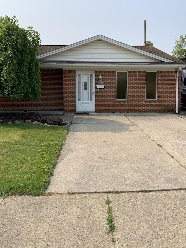 34203 Tomahawk St, Westland, MI 48185 - ranch-style home with brick siding and a front lawn