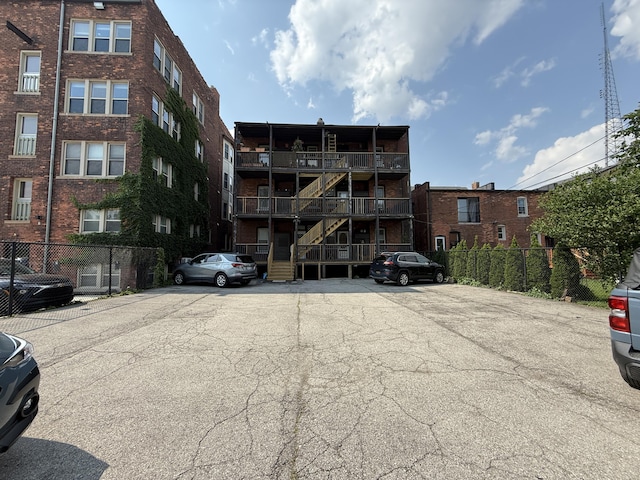469 W Willis St Unit 4, Detroit, MI 48201 - view of apartment building / complex with uncovered parking and stairs