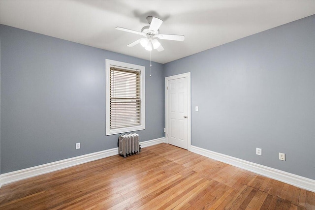 469 W Willis St Unit 4, Detroit, MI 48201 - unfurnished room with radiator heating unit, light wood-style flooring, and ceiling fan