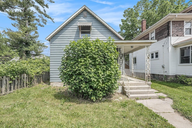 1169 3rd St NW, Grand Rapids, MI 49504 - view of front facade featuring covered porch