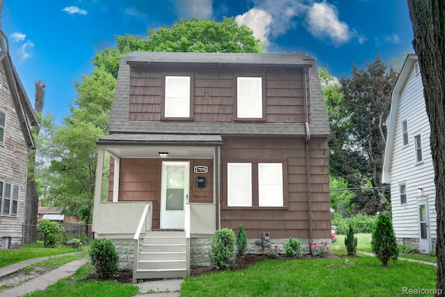 17376 Fielding St, Detroit, MI 48219 - view of front facade featuring a shingled roof and a front lawn
