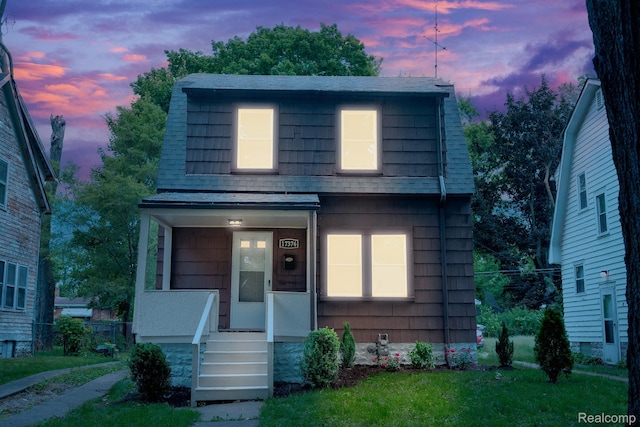 17376 Fielding St, Detroit, MI 48219 - view of front of house featuring a porch and roof with shingles