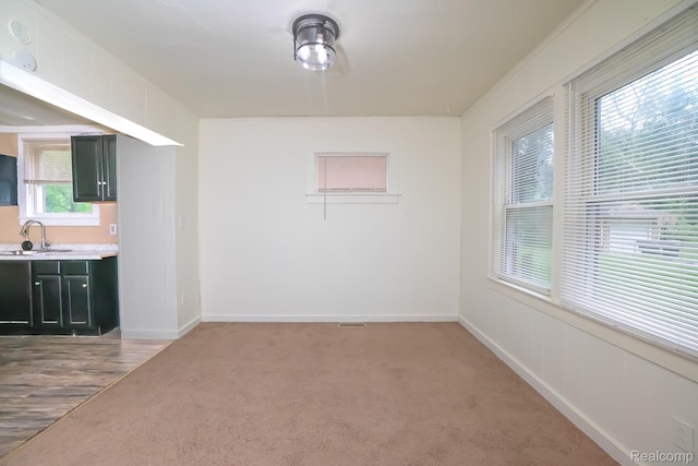 17376 Fielding St, Detroit, MI 48219 - unfurnished dining area with baseboards and light colored carpet