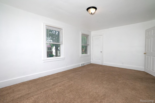 17376 Fielding St, Detroit, MI 48219 - unfurnished room featuring dark colored carpet and baseboards
