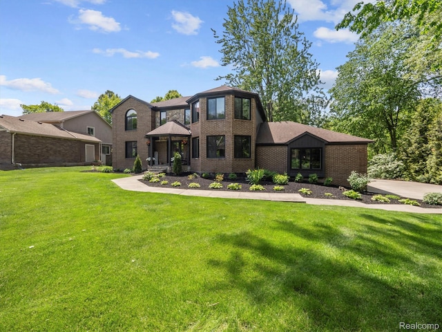 5695 Deerwood, Commerce Twp, MI 48382 - view of front facade featuring a front yard and brick siding