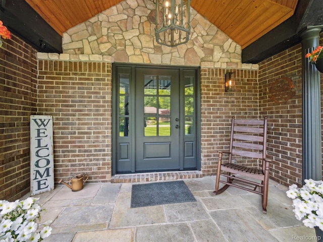 5695 Deerwood, Commerce Twp, MI 48382 - view of exterior entry featuring brick siding and stone siding