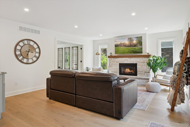 5695 Deerwood, Commerce Twp, MI 48382 - living area with a fireplace, light wood finished floors, and recessed lighting