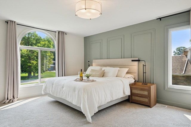5695 Deerwood, Commerce Twp, MI 48382 - bedroom with multiple windows and light carpet