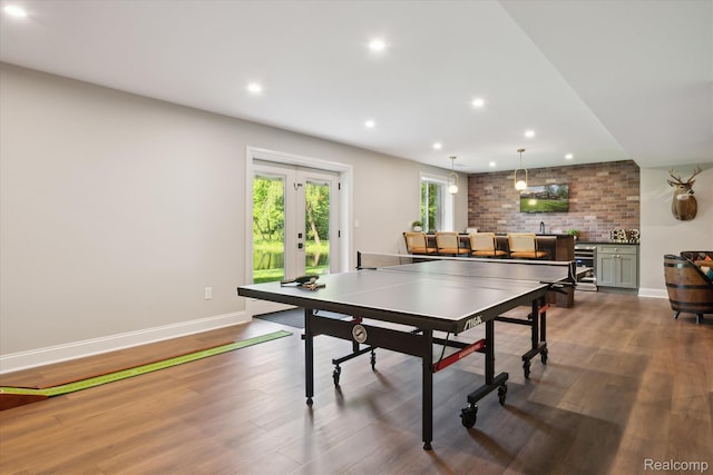 5695 Deerwood, Commerce Twp, MI 48382 - recreation room with french doors, wood finished floors, recessed lighting, and beverage cooler