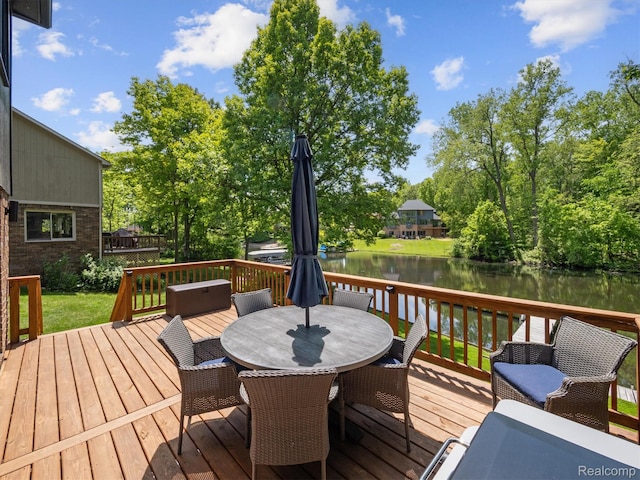 5695 Deerwood, Commerce Twp, MI 48382 - wooden deck with a water view and outdoor dining area
