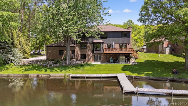 5695 Deerwood, Commerce Twp, MI 48382 - rear view of house featuring stairs, a deck with water view, and a yard