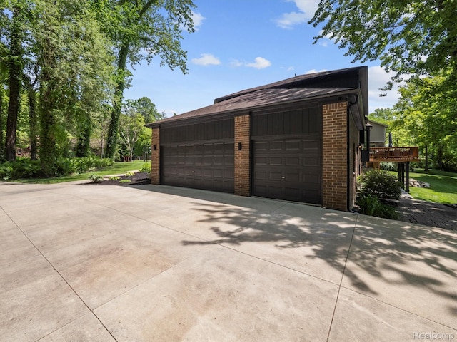 5695 Deerwood, Commerce Twp, MI 48382 - garage with concrete driveway