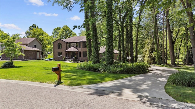 5695 Deerwood, Commerce Twp, MI 48382 - view of front of house with brick siding and a front yard