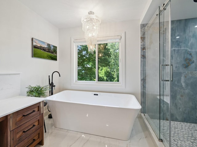 5695 Deerwood, Commerce Twp, MI 48382 - bathroom featuring a chandelier, a freestanding tub, marble finish floors, and a stall shower