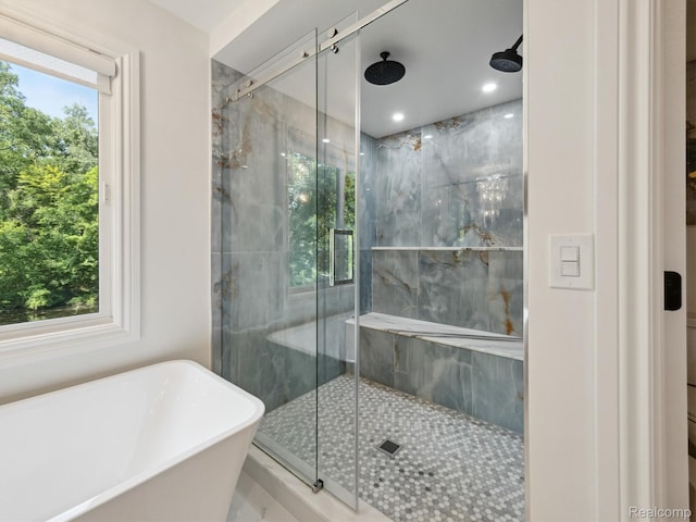 5695 Deerwood, Commerce Twp, MI 48382 - full bath with a marble finish shower and a soaking tub