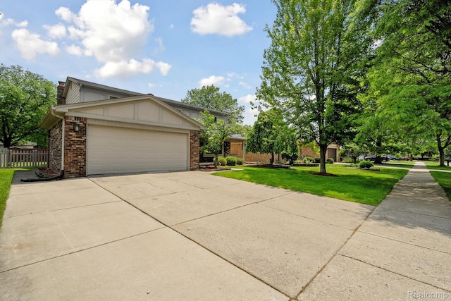 7302 Parkway Ct, Canton, MI 48187 - view of front of property with brick siding, a chimney, concrete driveway, and an attached garage
