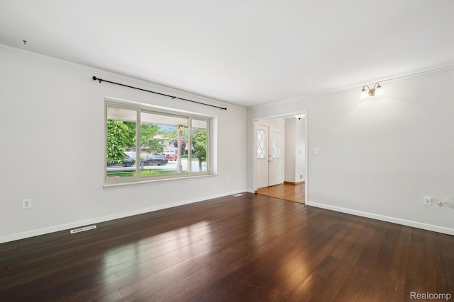 7302 Parkway Ct, Canton, MI 48187 - spare room with crown molding and dark wood-type flooring