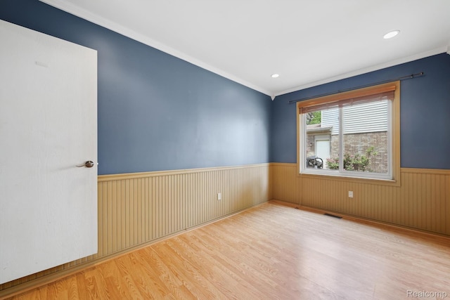 7302 Parkway Ct, Canton, MI 48187 - spare room featuring a wainscoted wall, wood finished floors, ornamental molding, and recessed lighting
