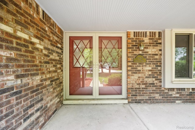 7302 Parkway Ct, Canton, MI 48187 - doorway to property featuring brick siding and french doors