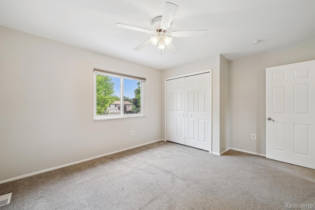 7302 Parkway Ct, Canton, MI 48187 - unfurnished bedroom featuring carpet, a closet, and a ceiling fan