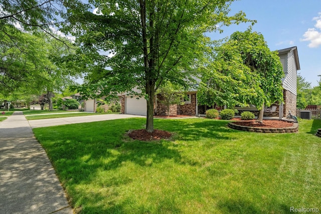 7302 Parkway Ct, Canton, MI 48187 - view of property hidden behind natural elements featuring driveway, brick siding, a front lawn, and an attached garage