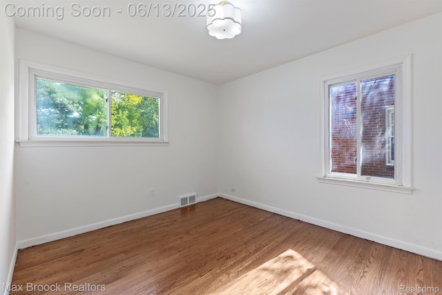 24811 Sherman St, Oak Park, MI 48237 - spare room with healthy amount of natural light, wood finished floors, and baseboards