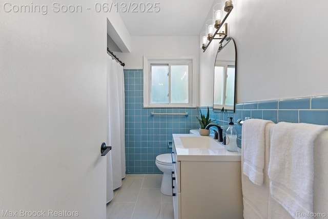 24811 Sherman St, Oak Park, MI 48237 - bathroom with tile walls, vanity, and toilet