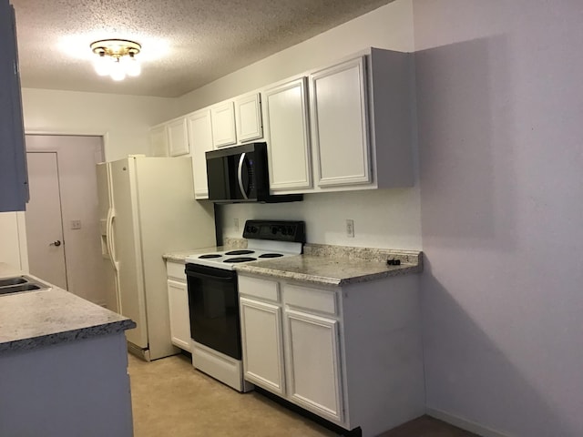 1077 Wedgewood Dr, Plainwell, MI 49080 - kitchen with range with electric cooktop, black microwave, a textured ceiling, light countertops, and white cabinetry