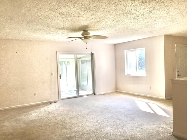 1077 Wedgewood Dr, Plainwell, MI 49080 - carpeted empty room featuring a ceiling fan and a textured ceiling