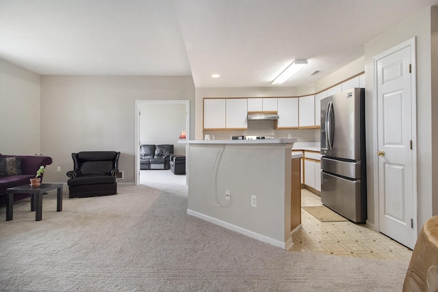 1468 Fox Pointe Cir, Ann Arbor, MI 48108 - kitchen with freestanding refrigerator, open floor plan, under cabinet range hood, white cabinets, and light countertops