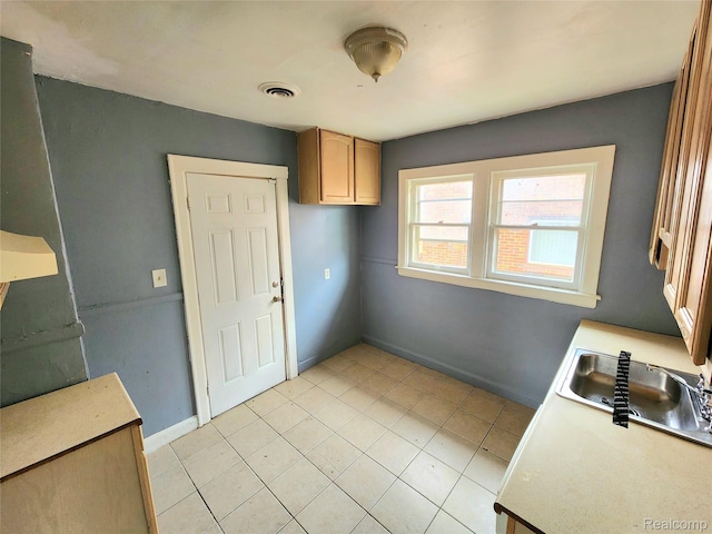 16612 Ilene St, Detroit, MI 48221 - kitchen featuring light countertops and light tile patterned floors