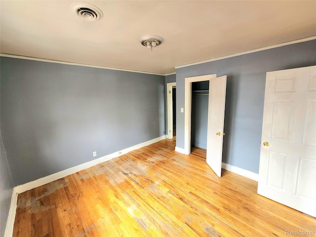 16612 Ilene St, Detroit, MI 48221 - unfurnished bedroom featuring ornamental molding, light wood-style floors, and a closet