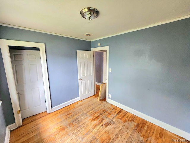 16612 Ilene St, Detroit, MI 48221 - unfurnished bedroom featuring crown molding and light wood-style flooring