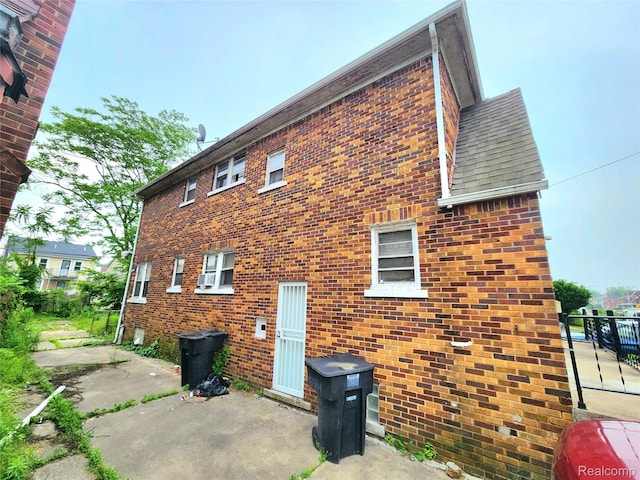 16612 Ilene St, Detroit, MI 48221 - view of property exterior with a patio and brick siding