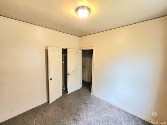 16612 Ilene St, Detroit, MI 48221 - unfurnished bedroom with dark carpet and a closet