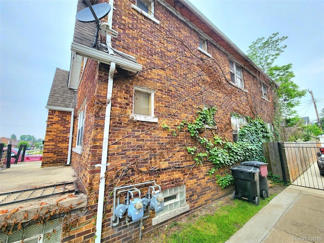 16612 Ilene St, Detroit, MI 48221 - view of home's exterior with brick siding, roof with shingles, a deck, and a gate