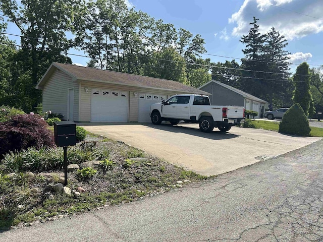112 Kilkenny Dr, Onsted, MI 49265 - view of side of property with a garage and an outbuilding