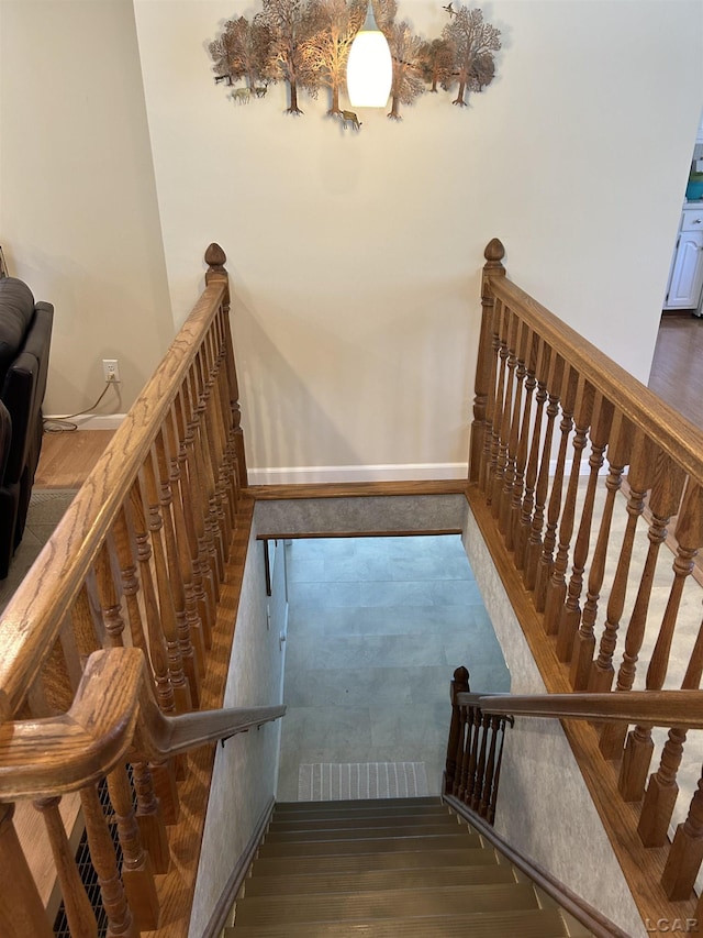 112 Kilkenny Dr, Onsted, MI 49265 - stairs featuring wood finished floors and baseboards