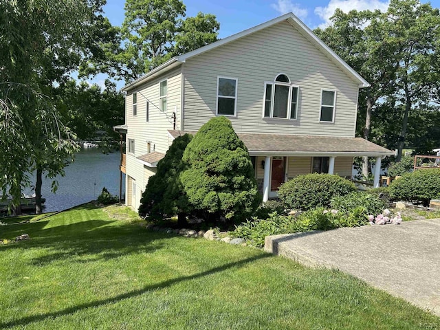 112 Kilkenny Dr, Onsted, MI 49265 - view of front facade featuring a front yard and covered porch