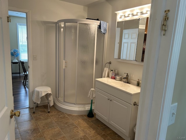 112 Kilkenny Dr, Onsted, MI 49265 - bathroom with a shower stall, vanity, and stone finish flooring