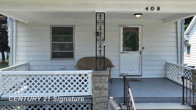 408 S Alp St, Bay City, MI 48706 - property entrance featuring covered porch