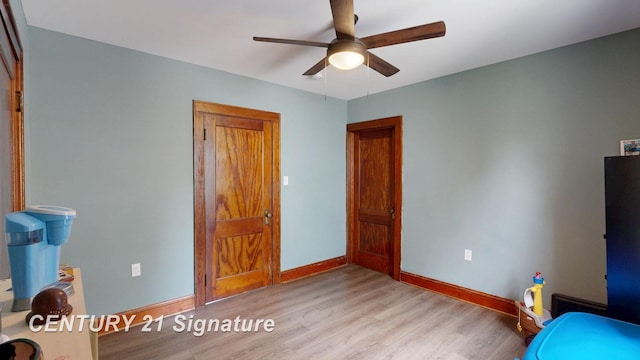 408 S Alp St, Bay City, MI 48706 - unfurnished bedroom with light wood-style floors and a ceiling fan