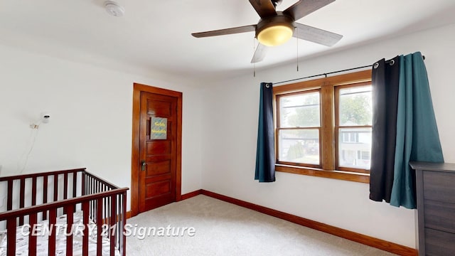 408 S Alp St, Bay City, MI 48706 - unfurnished bedroom featuring carpet flooring, a ceiling fan, and a crib