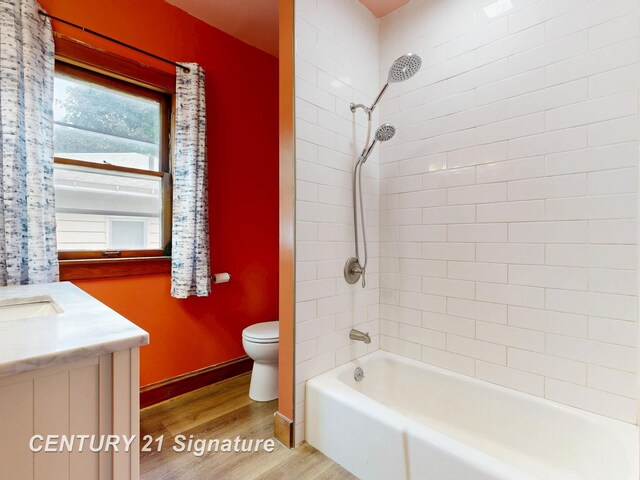 408 S Alp St, Bay City, MI 48706 - full bath featuring wood finished floors, tub / shower combination, and vanity