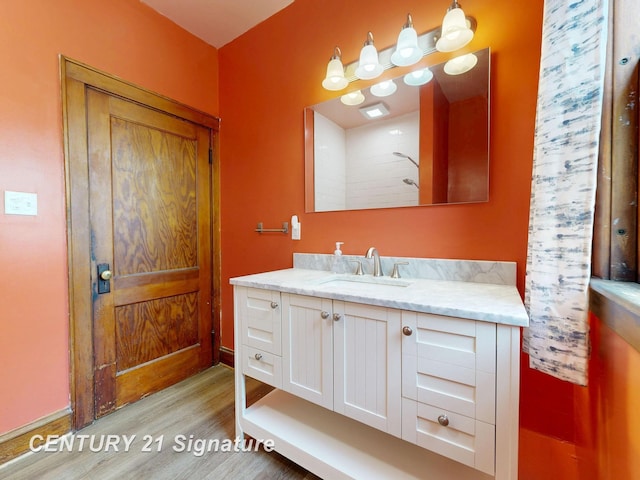 408 S Alp St, Bay City, MI 48706 - bathroom with wood finished floors and vanity
