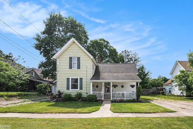 103 Lenawee St, Durand, MI 48429 - traditional home featuring a porch and a shingled roof