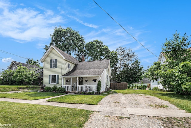 103 Lenawee St, Durand, MI 48429 - traditional home with a porch, a shingled roof, and a chimney